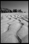 Logan's Rock,Pednavounder beach black and white, sand lines, cliffs