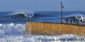 big wave and harbour wall porthleven